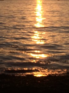 Sunset reflected in the waters of Kits Beach.